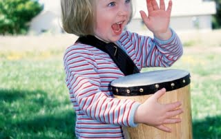 Child with Autism Playing Conga Drum